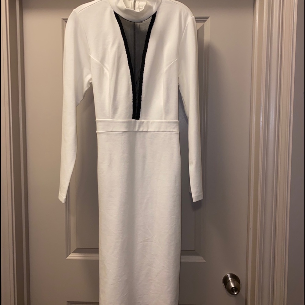 Cream colored long sleeve mini dress.